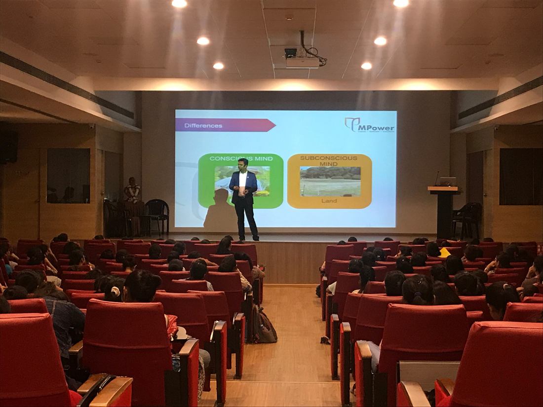 Pankkaj presenting in an auditorium