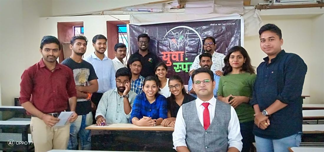 Pankkaj with participants at a youth event